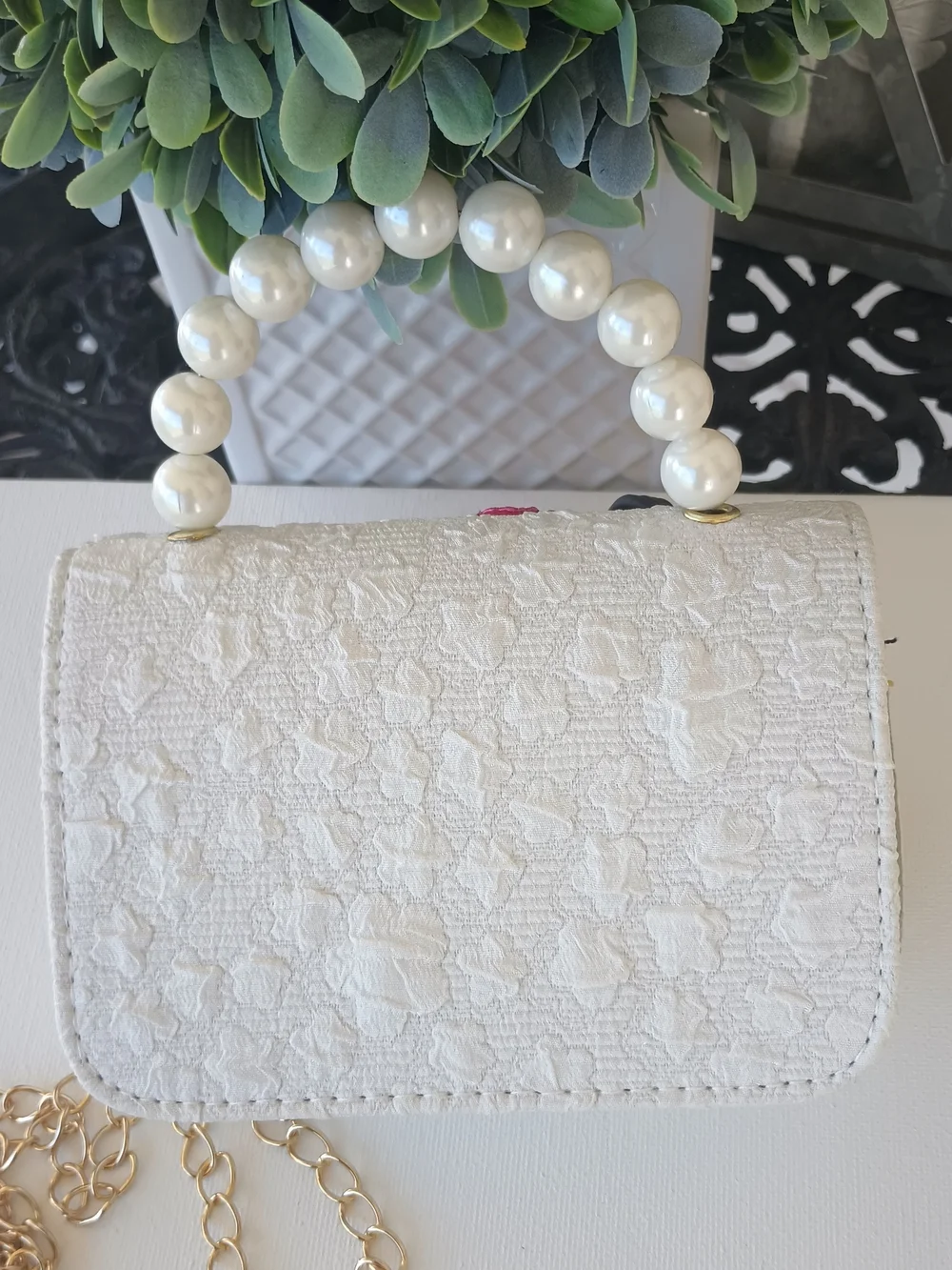 Handcrafted Pearl Handle Mini Bag With Clay Doll& Floral Applique.